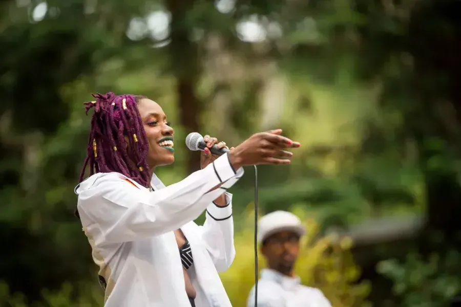 A woman sings at Stern Grove.